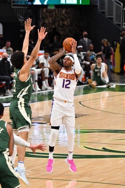 Torrey Craig of the Phoenix Suns shoots a three-pointer against the Milwaukee Bucks during Game Three of the 2021 NBA Finals on July 11, 2021 at...