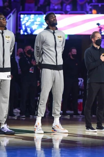 Deandre Ayton of the Phoenix Suns listens to the national anthem before the game against the Milwaukee Bucks during Game Three of the 2021 NBA Finals...