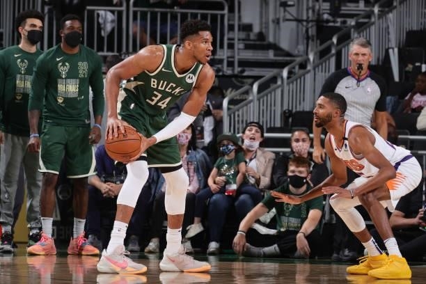 Giannis Antetokounmpo of the Milwaukee Bucks dribbles the ball during Game Three of the 2021 NBA Finals on July 11, 2021 at the Fiserv Forum Center...