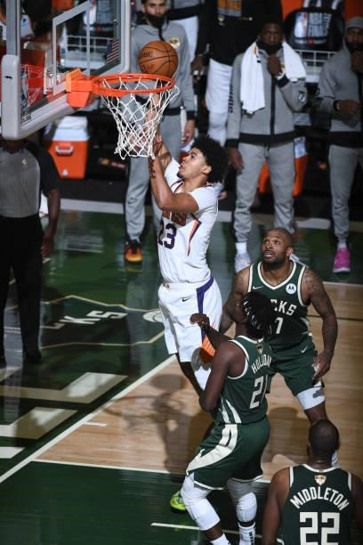 July 11: Cameron Johnson of the Phoenix Suns drives to the basket against the Milwaukee Bucks during Game Three of the 2021 NBA Finals on July 11,...