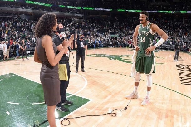 Giannis Antetokounmpo of the Milwaukee Bucks talks to ESPN Sideline Reporter, Malika Andrews, after the game against the Phoenix Suns during Game...