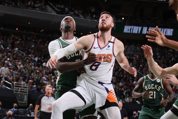 Frank Kaminsky of the Phoenix Suns and Bobby Portis of the Milwaukee Bucks fight for position during Game Three of the 2021 NBA Finals on July 11,...