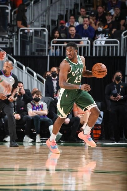 Thanasis Antetokounmpo of the Milwaukee Bucks handles the ball during the game against the Phoenix Suns during Game Three of the 2021 NBA Finals on...