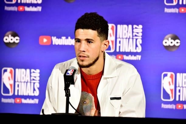 July 11: Devin Booker of the Phoenix Suns talks to the media after the game against the Milwaukee Bucks during Game Three of the 2021 NBA Finals on...