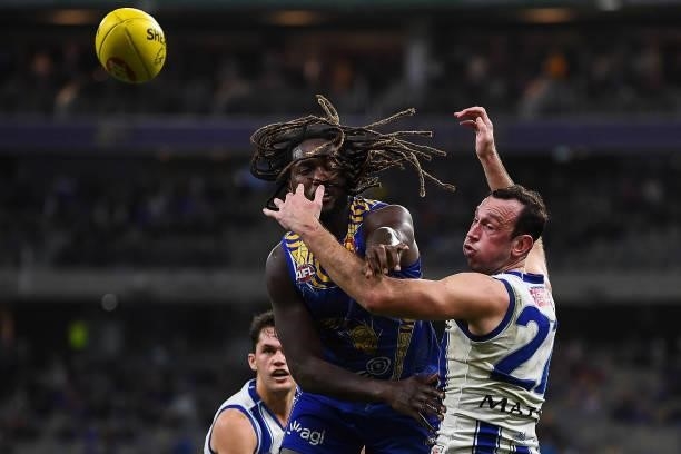 Nic Naitanui of the Eagles competes a throw-in with Todd Goldstein of the Kangaroos during the 2021 AFL Round 17 match between the West Coast Eagles...