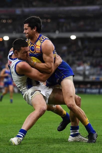 Liam Duggan of the Eagles is tackled by Luke Davies-Uniacke of the Kangaroos during the 2021 AFL Round 17 match between the West Coast Eagles and the...