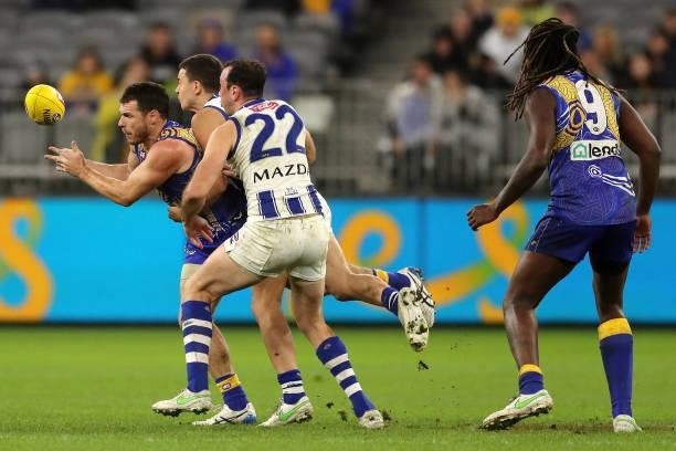 Luke Shuey of the Eagles handpasses the ball during the 2021 AFL Round 17 match between the West Coast Eagles and the North Melbourne Kangaroos at...