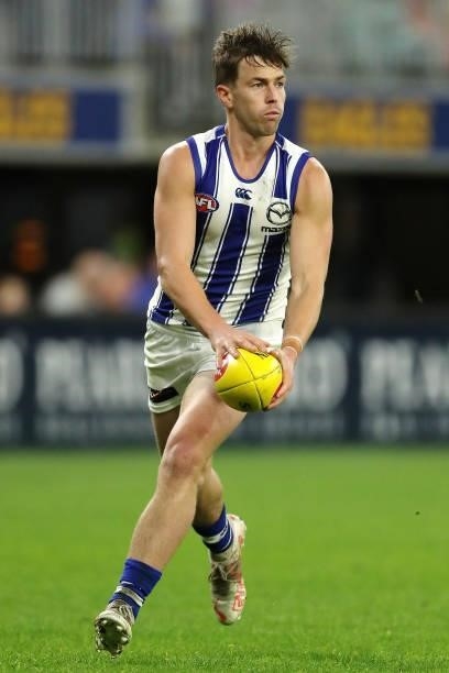 Trent Dumont of the Kangaroos looks to pass the ball during the 2021 AFL Round 17 match between the West Coast Eagles and the North Melbourne...