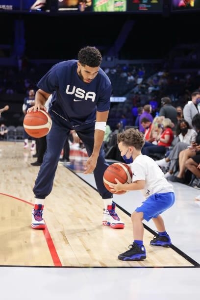 Jayson Tatum of the USA Men's National Team and his son, Jayson Tatum Jr warm up before the game against the Nigeria Men's National Team on July 10,...