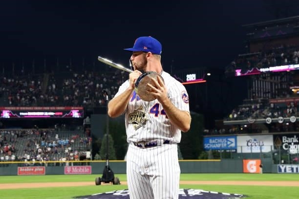Pete Alonso of the New York Mets kisses the Home Run Derby championship trophy after winning the 2021 T-Mobile Home Run Derby at Coors Field on...
