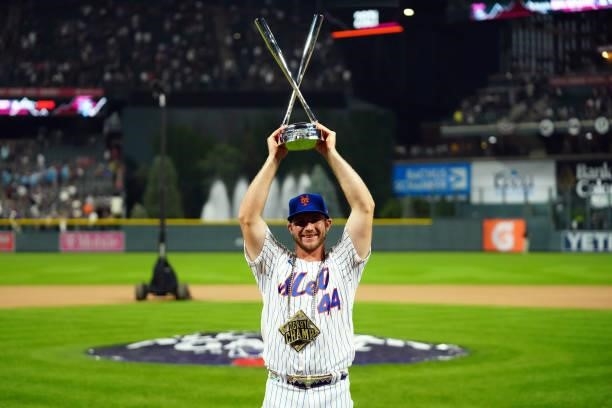 Pete Alonso of the New York Mets celebrates winning his second straight home run derby title during the 2021 T-Mobile Home Run Derby at Coors Field...