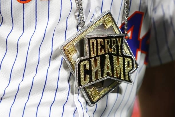 Detailed view of the necklace worn by Pete Alonso of the New York Mets after he won the 2021 T-Mobile Home Run Derby at Coors Field on Monday, July...