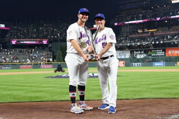 Pete Alonso and Dave Jauss of the New York Mets hold the Home Run Derby championship trophy after Alonso won the 2021 T-Mobile Home Run Derby at...