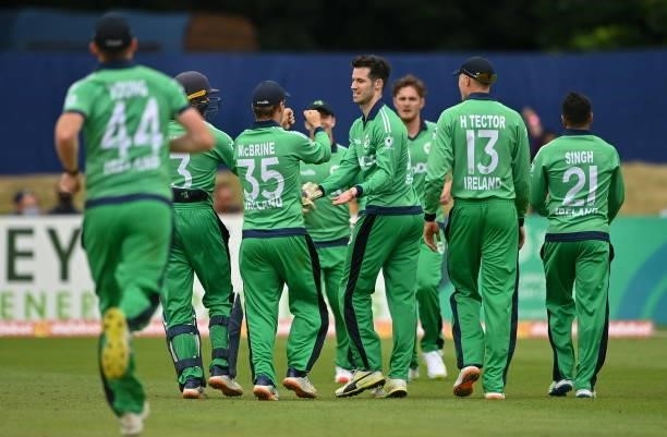 Dublin , Ireland - 13 July 2021; George Dockrell of Ireland celebrates with team-mates after claiming the wicket of South Africa's Janneman Malan...