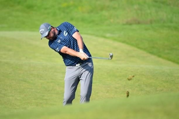 Australia's Marc Leishman plays his approach shot to the 17th green during a practice round for The 149th British Open Golf Championship at Royal St...