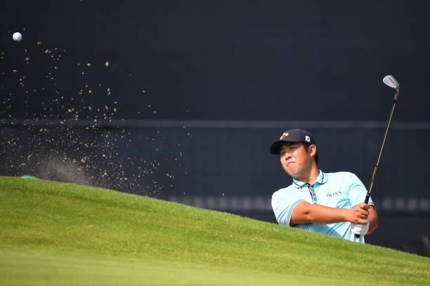 Korea's An Byeong-Hun plays from a green-side bunker on the 18th during a practice round for The 149th British Open Golf Championship at Royal St...