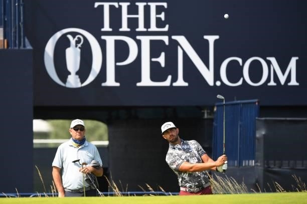 South Africa's Erik Van Rooyen chips onto the 18th green during a practice round for The 149th British Open Golf Championship at Royal St George's,...