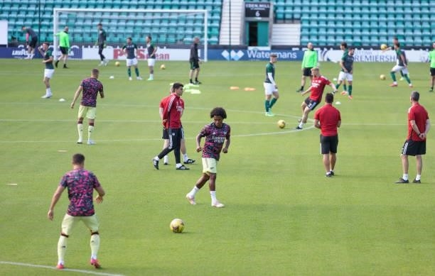 Arsenal and Hibernian players pre match warm up at Easter Road on July 13, 2021 in Edinburgh, Scotland.