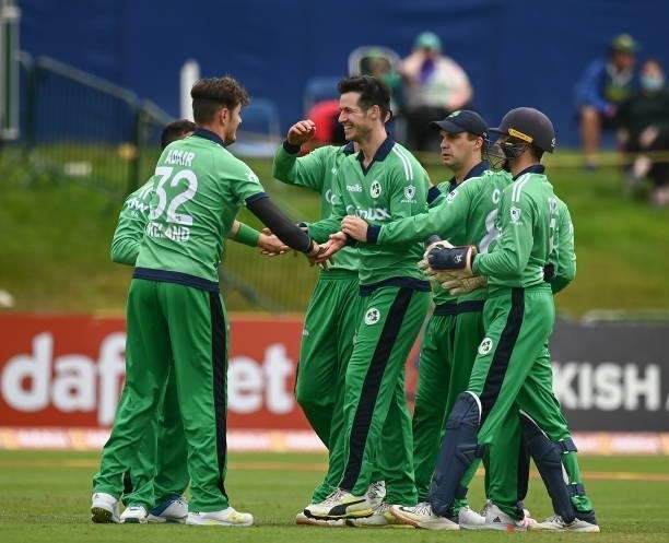 Dublin , Ireland - 13 July 2021; George Dockrell of Ireland, centre, celebrates the wicket of Janneman Malan of South Africa with team-mates during...