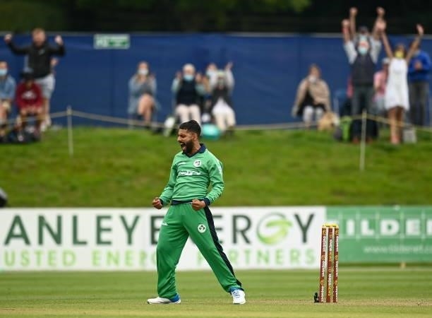 Dublin , Ireland - 13 July 2021; Simi Singh of Ireland celebrates the wicket of David Miller of South Africa during the 2nd Dafanews Cup Series One...