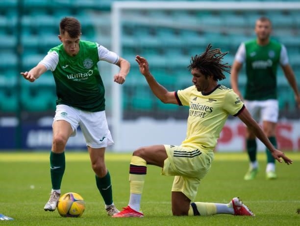 Hibernian's Steven Bradley is challenged by Mohame Elneny of Arsenal during a pre-season friendly between Hibernian and Arsenal at Easter Road, on...