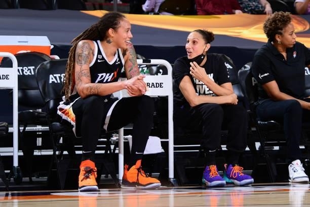 Brittney Griner talks with Diana Taurasi of the Phoenix Mercury during the game against the Seattle Storm on July 9, 2021 at Phoenix Suns Arena in...