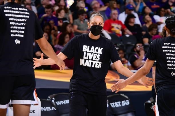 Diana Taurasi of the Phoenix Mercury hi-fives teammates before the game against the Seattle Storm on July 9, 2021 at Phoenix Suns Arena in Phoenix,...