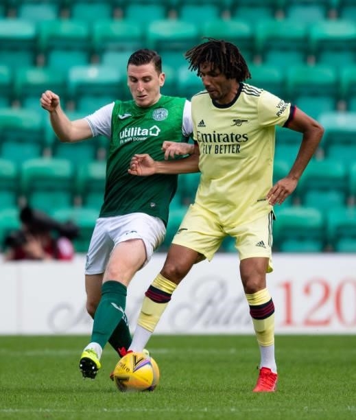 Hibernian's Paul Hanlon challenges Mohamed Elneny of Arsenal during a pre-season friendly between Hibernian and Arsenal at Easter Road, on July 13 in...