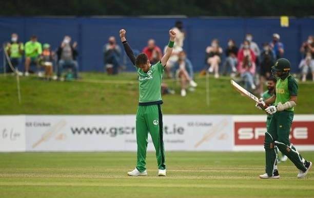 Dublin , Ireland - 13 July 2021; Mark Adair of Ireland celebrates the wicket of Keshav Maharaj of South Africa during the 2nd Dafanews Cup Series One...