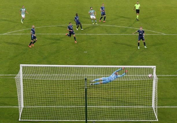 Dublin , Ireland - 13 July 2021; Richie Towell of Shamrock Rovers scores his side's goal past Slovan Bratislava goalkeeper Adrián Chovan during the...