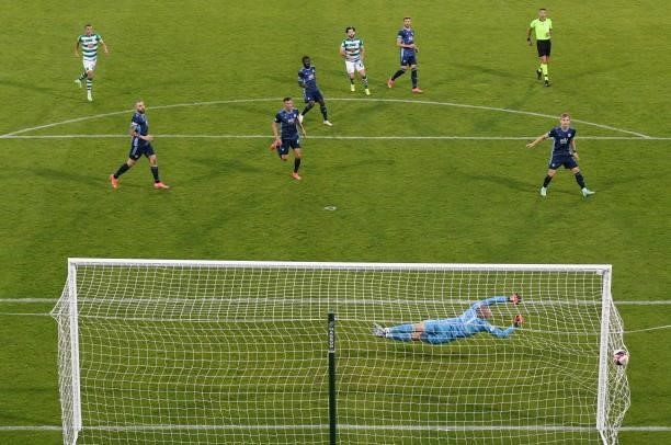 Dublin , Ireland - 13 July 2021; Richie Towell of Shamrock Rovers scores his side's goal past Slovan Bratislava goalkeeper Adrián Chovan during the...
