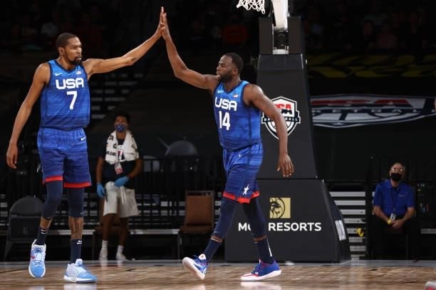 Draymond Green of the USA Men's National Team high fives Kevin Durant of the USA Men's National Team during the game against the Argentina Men's...
