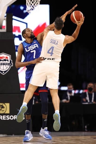 Kevin Durant of the USA Men's National Team plays defense on Luis Scola of the Argentina Men's National Team during the game on July 13, 2021 at...