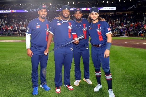 Vladimir Guerrero Jr. #27 of the Toronto Blue Jays poses with his teammates Marcus Semien, Teoscar Hernandez, Bo Bichette and the Ted Williams...