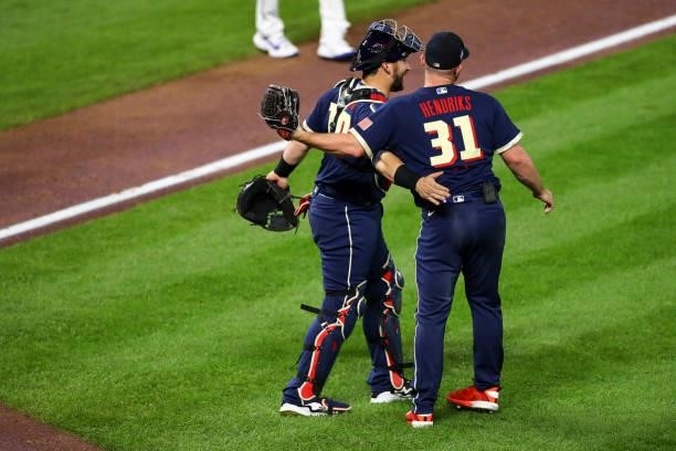 Mike Zunino of the Tampa Bay Rays celebrates with Liam Hendriks of the Chicago White Sox after the 91st MLB All-Star Game presented by Mastercard at...