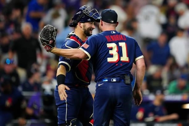 Liam Hendriks of the Chicago White Sox celebrates with Mike Zunino of the Tampa Bay Rays after the American League defeated the National League in...