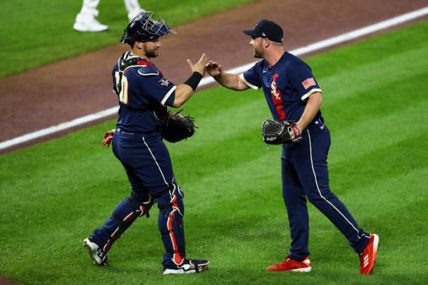 Mike Zunino of the Tampa Bay Rays celebrates with Liam Hendriks of the Chicago White Sox after the 91st MLB All-Star Game presented by Mastercard at...