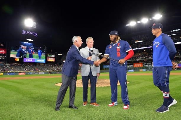 Major League Baseball Commissioner Robert D. Manfred, Jr. Presents the Ted Williams All-Star Game MVP trophy to Vladimir Guerrero Jr. #27 of the...
