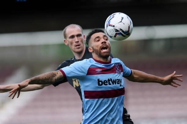 Ryan Fredericks of West Ham United in action with Mitch Pinnock of Northampton Town during the Pre-season friendly between Northampton Town and West...