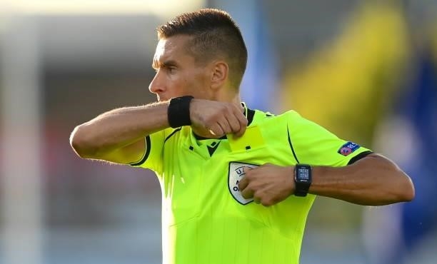 Dublin , Ireland - 13 July 2021; Referee Mario Zebec takes a yellow card from his pocket during the UEFA Champions League first qualifying round...