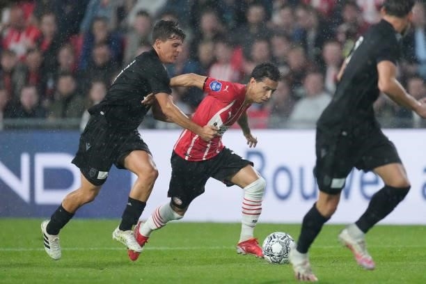 Thomas Murg of PAOK FC, Mauro Junior of PSV during the Club Friendly match between PSV v PAOK Saloniki at the Philips Stadium on July 14, 2021 in...