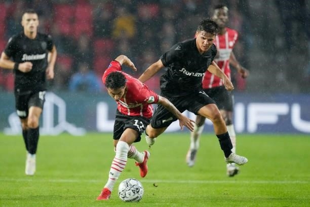 Mauro Junior of PSV, Thomas Murg of PAOK FC during the Club Friendly match between PSV v PAOK Saloniki at the Philips Stadium on July 14, 2021 in...