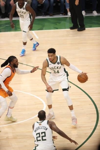 Giannis Antetokounmpo of the Milwaukee Bucks handles the ball during the game against the Phoenix Suns during Game Four of the 2021 NBA Finals on...