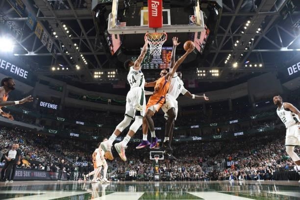 Cameron Payne of the Phoenix Suns drives to the basket during the game against the Milwaukee Bucks during Game Four of the 2021 NBA Finals on July...