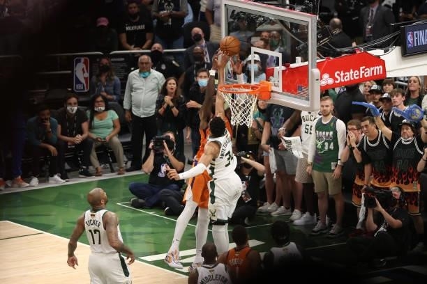 Giannis Antetokounmpo of the Milwaukee Bucks blocks the shot of Deandre Ayton of the Phoenix Suns during Game Four of the 2021 NBA Finals on July 14,...