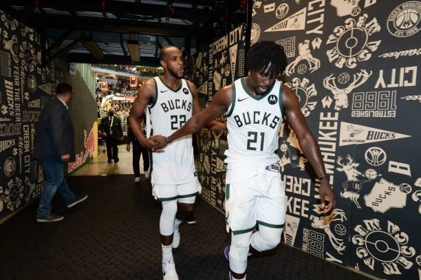 Khris Middleton of the Milwaukee Bucks high fives Jrue Holiday of the Milwaukee Bucks after the game during Game Four of the 2021 NBA Finals on July...