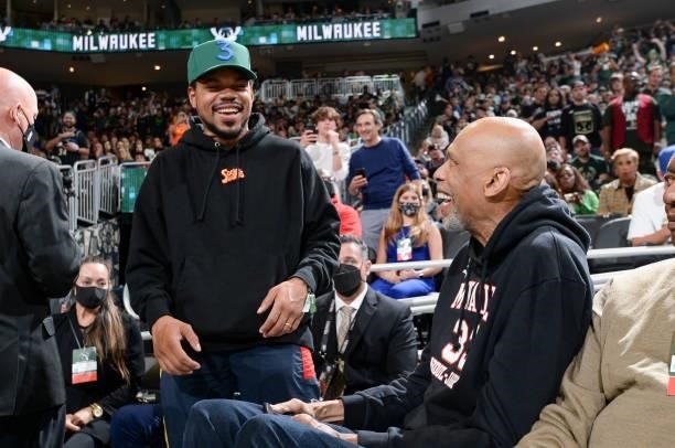 Rapper, Chance the Rapper talks to NBA Legend, Kareem Abdul-Jabbar before the game between the Phoenix Suns and Milwaukee Bucks during Game Four of...