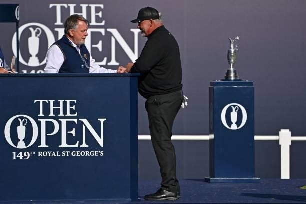 Northern Ireland's Darren Clarke arrives on the 1st tee box ahead of his first round on day one of The 149th British Open Golf Championship at Royal...