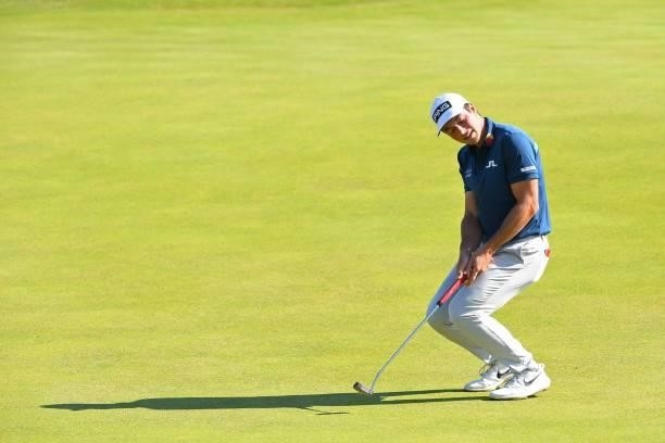 Norway's Viktor Hovland reacts to a missed putt on the 6th green during his first round on day one of The 149th British Open Golf Championship at...
