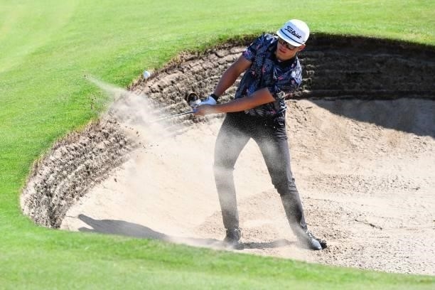 South Africa's Garrick Higgo plays out of a green-side bunker on the 6th hole during his first round on day one of The 149th British Open Golf...